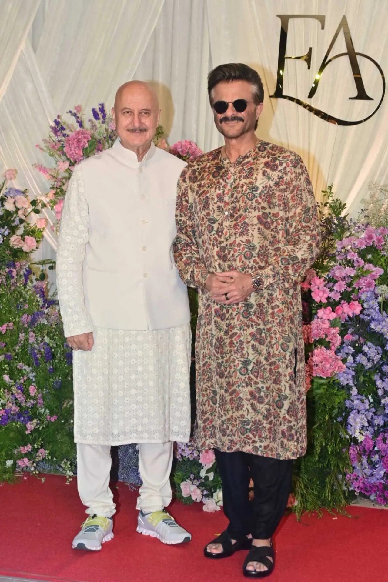 <p><span class="hover:entity-accent entity-underline inline cursor-pointer align-baseline"><span class="whitespace-normal">Anil Kapoor</span></span> and <span class="hover:entity-accent entity-underline inline cursor-pointer align-baseline"><span class="whitespace-normal">Anupam Kher</span></span> were also spotted at the wedding reception. Anil Kapoor looked stylish in a printed kurta paired with black trousers, completing his look with sunglasses and sandals. Anupam Kher opted for a classic ivory kurta set.</p>